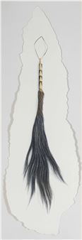 A minimalist composition featuring a dark, feather-like object suspended within a jagged white shape.
