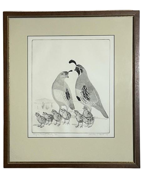 A framed black-and-white print of a quail family with two adults and several chicks.