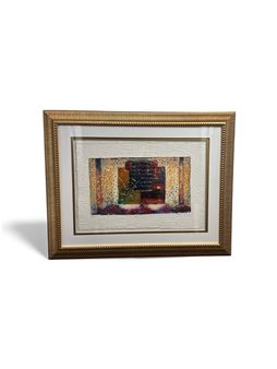 A framed abstract artwork featuring a textured gold frame and a colorful, layered central image.