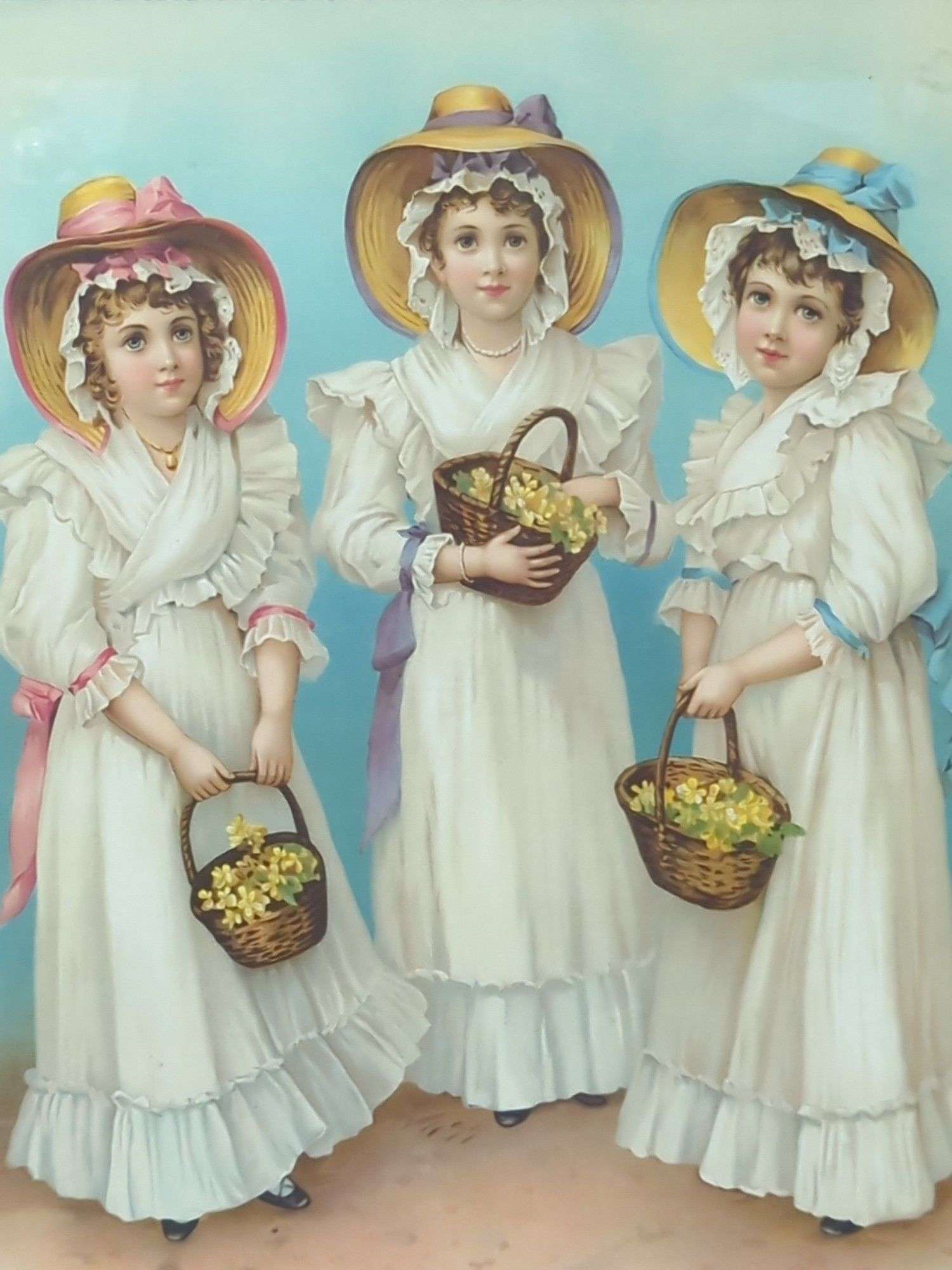 Two framed paintings depicting women in historical dress, one with three figures and another with two figures under a floral arch.