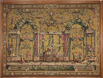 A rare wool and silk tapestry depicting, against a tobacco-colored background, a rich “grotesque” composition featuring dancing musicians and a figure playing the trumpet seated on an elephant draped with a lambrequin