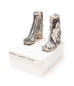 Pair of Tabi ankle boots covered in graffiti