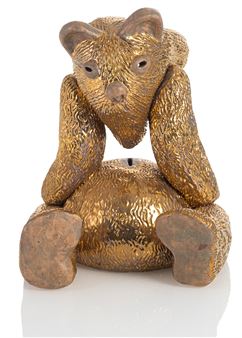 A golden, textured bear figure with a contemplative pose and a small hole on its belly.