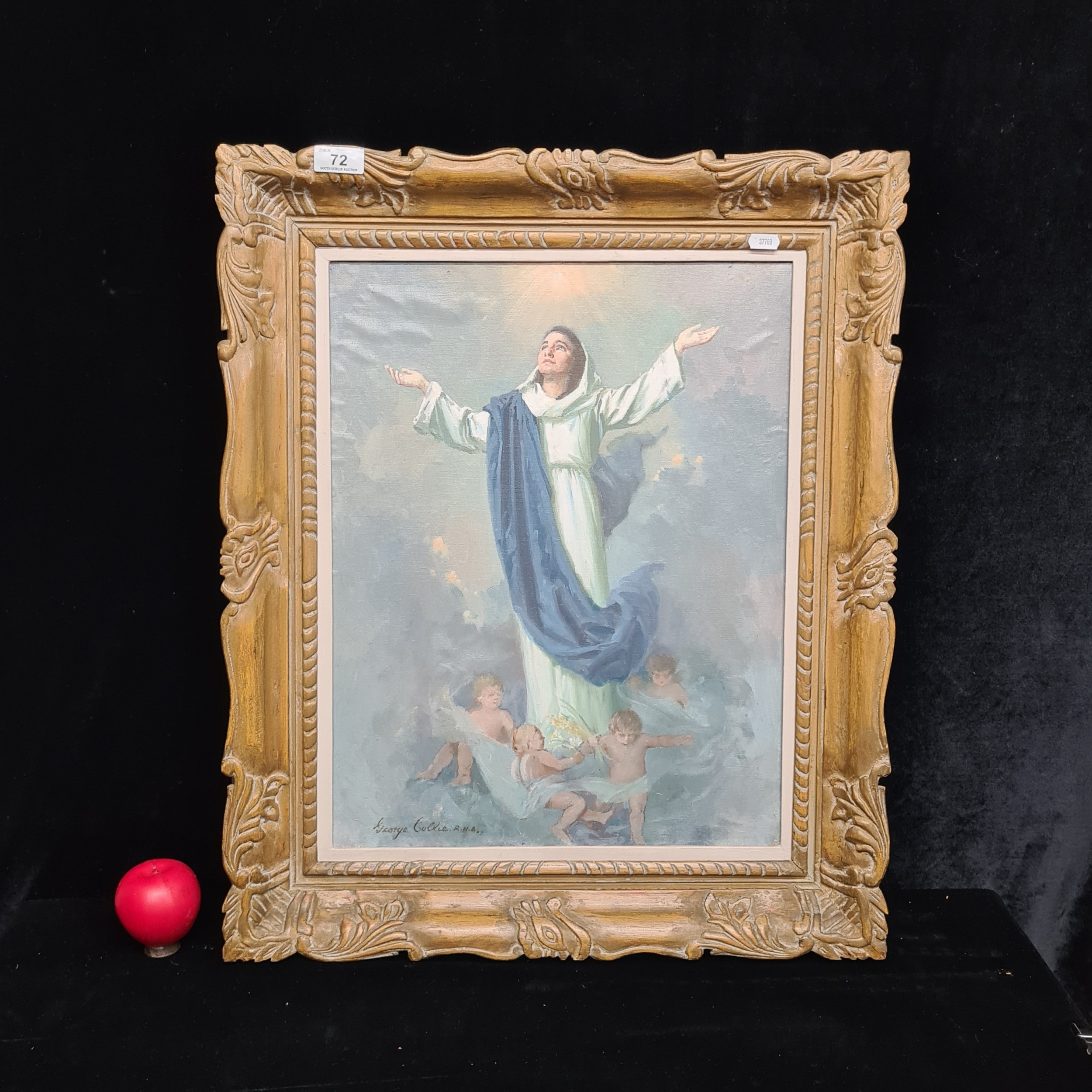 A framed religious painting depicts a central figure with arms raised, surrounded by small figures below.