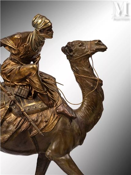 A bronze sculpture of a figure riding a camel, rendered in realistic detail with warm metallic tones.