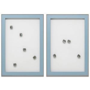 A minimalist composition featuring two light blue framed panels with scattered metallic cubes.