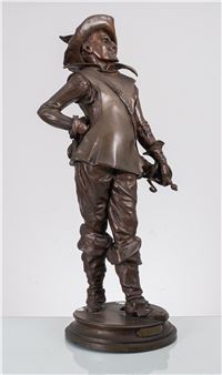 A bronze statue of a standing figure in historical attire holding a sword.