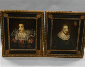 A pair of ornate frames holding classical-style portraits of a woman and a man.