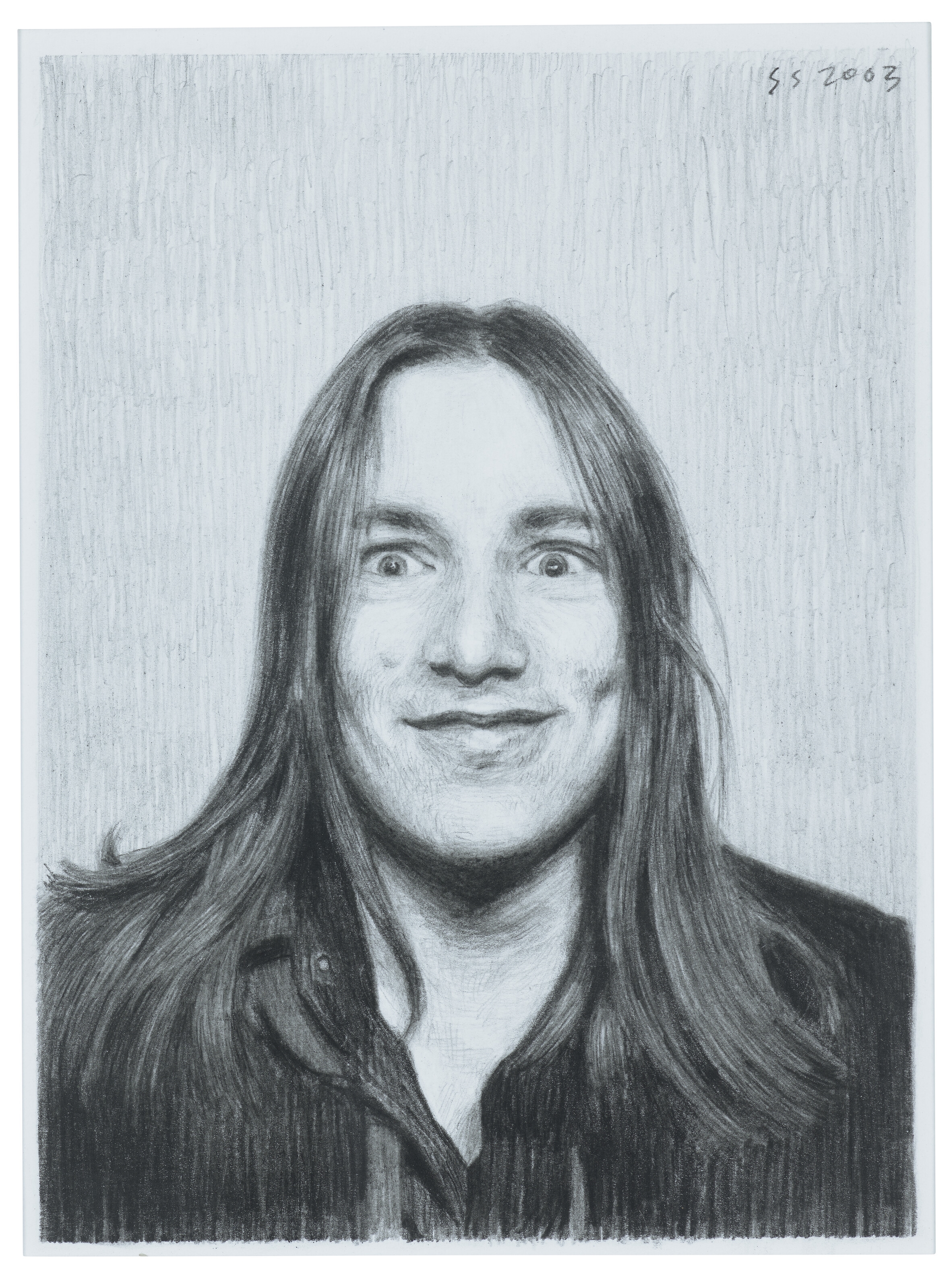 A hyper-realistic charcoal portrait of a person with wide eyes and long hair.