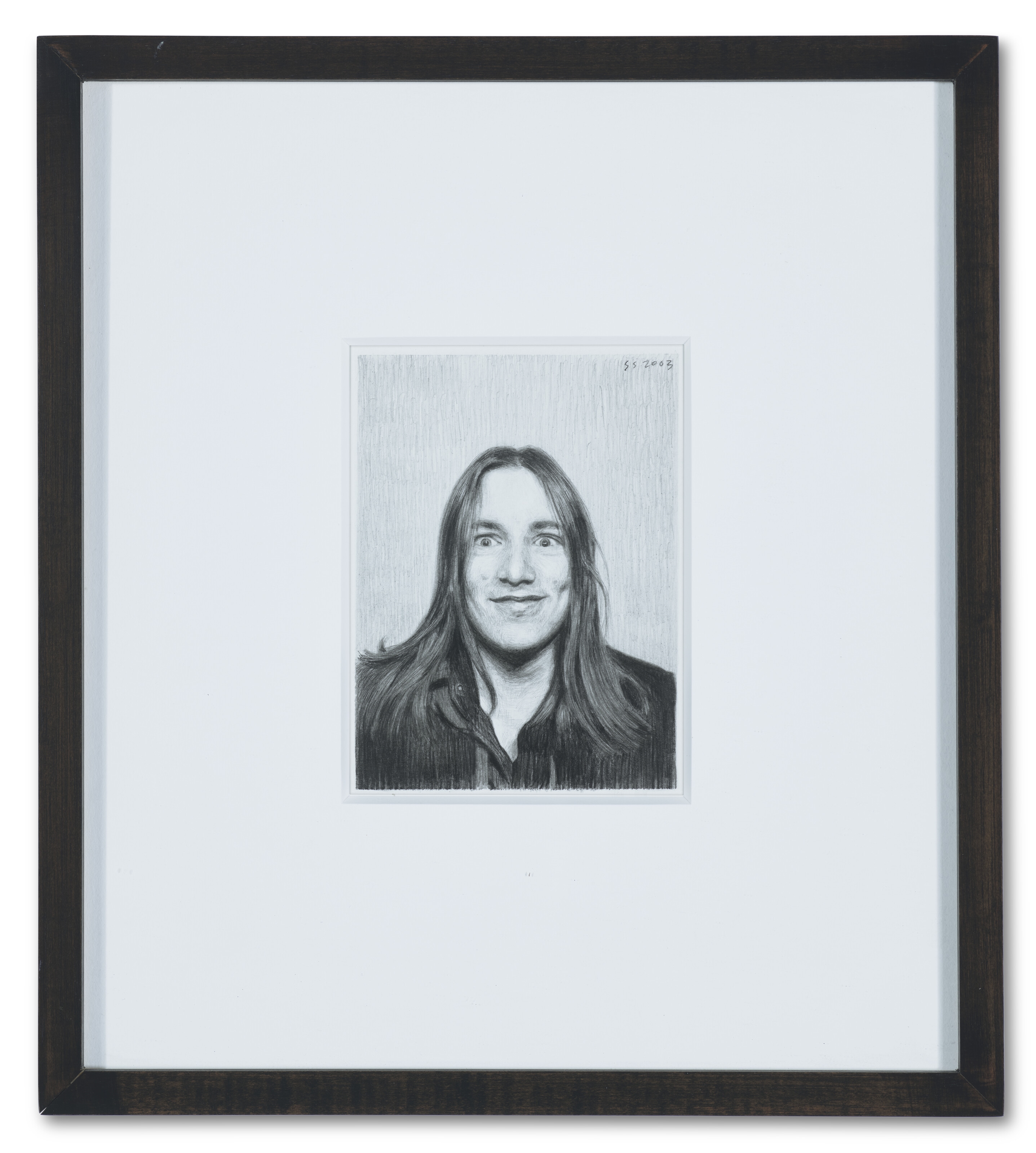 A hyper-realistic charcoal portrait of a person with wide eyes and long hair.