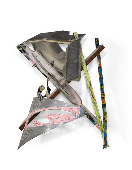 A chaotic assemblage of metallic and patterned strips forming an abstract, three-dimensional sculpture.
