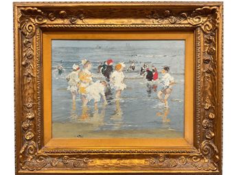 A framed painting of children playing in the ocean.