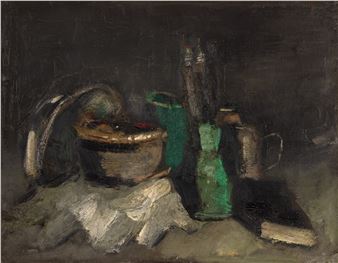 A moody still life featuring a woven basket, green glass bottles, and a white cloth against a dark background.