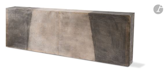 A minimalist concrete console table with a geometric, blocky design.