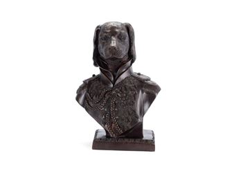 A bronze bust of a dog in military uniform.