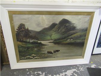 A framed landscape painting depicting a serene valley with grazing cattle and distant mountains.
