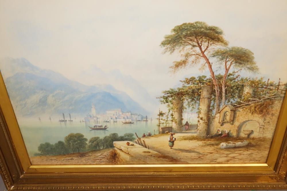A pair of framed landscape paintings depicting coastal scenes with boats, trees, and distant mountains.