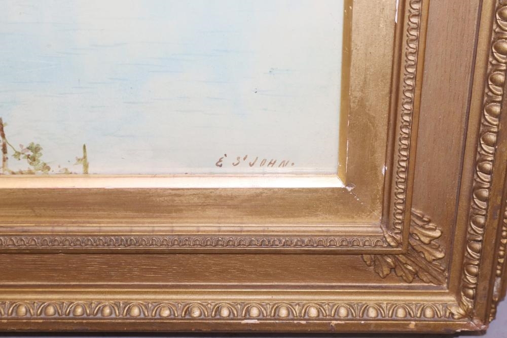 A pair of framed landscape paintings depicting coastal scenes with boats, trees, and distant mountains.