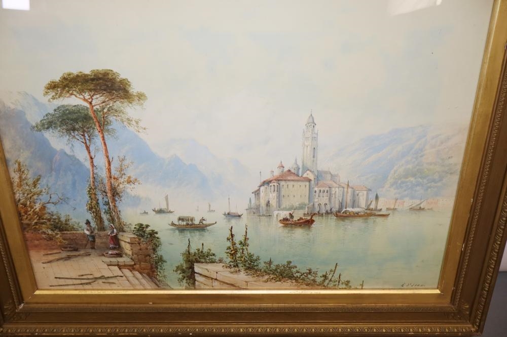 A pair of framed landscape paintings depicting coastal scenes with boats, trees, and distant mountains.