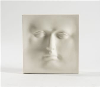 "A minimalist sculpture featuring a softly modeled human face emerging from a square ceramic tile."