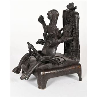 A dark, textured sculpture of a seated figure holding a hat against a plain background.