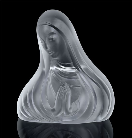 A translucent glass sculpture of a figure with closed eyes and hands clasped in prayer.