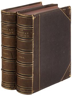 A pair of vintage leather-bound books standing side by side.