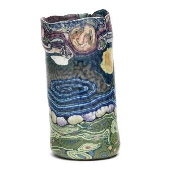 A colorful, abstract ceramic vase featuring swirling organic patterns and a vibrant palette of blues, greens, and purples.
