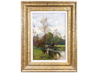 A framed landscape painting of a tranquil river scene with trees and reflections.