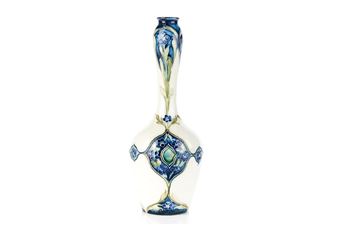 A tall, slender vase with a long neck and bulbous body, decorated in blue floral patterns against a white background.