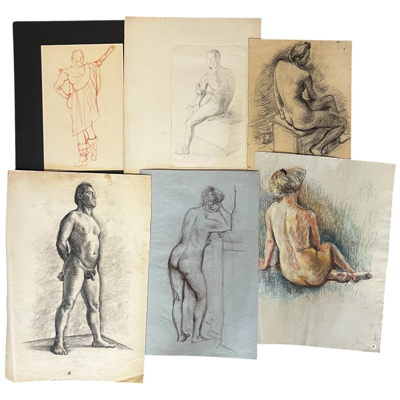 A collection of framed and unframed drawings featuring classical figures, portraits, and a landscape scene.