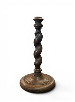 Turned and stained wooden torch with a twisted shaft and circular base Picture