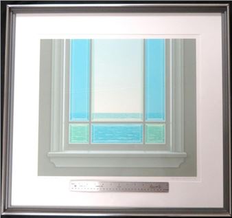 A framed print of a window looking out onto a calm sea.