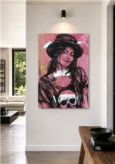 A stylized portrait of a figure in a hat with a skull motif, displayed on a modern wall.
