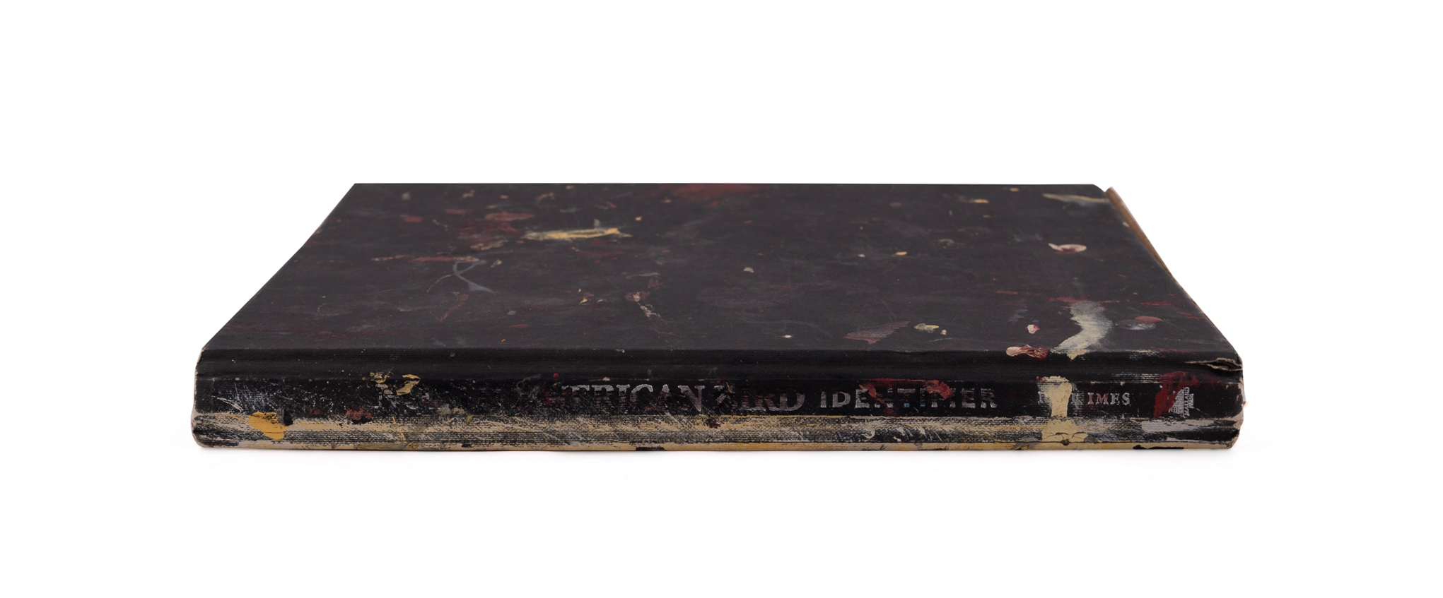 A worn, dark-bound book with visible signs of age and use.