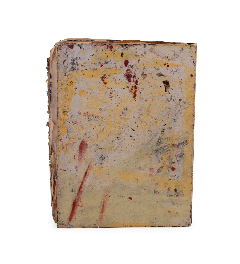 A worn, dark-bound book with visible signs of age and use.