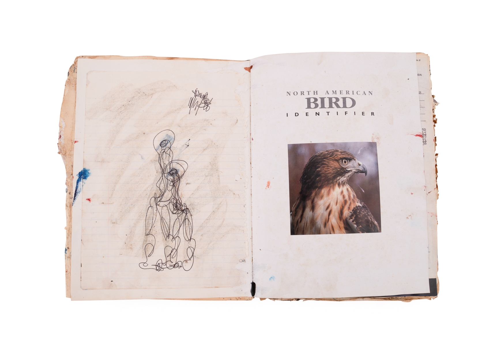 A worn, dark-bound book with visible signs of age and use.