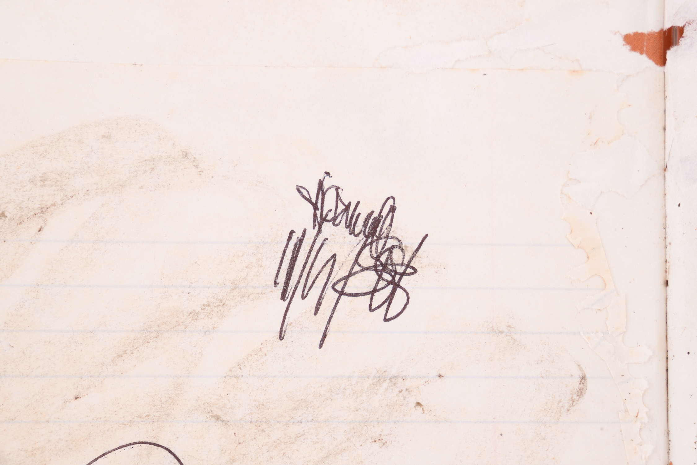 A worn, dark-bound book with visible signs of age and use.