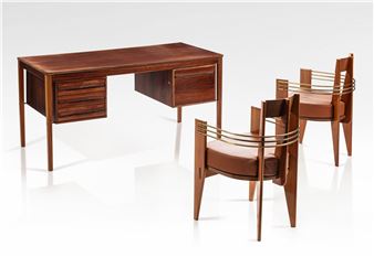 A mid-century modern desk and two chairs with brass wire details.