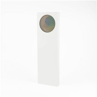 A minimalist sculpture featuring a white rectangular block with a circular, iridescent window.