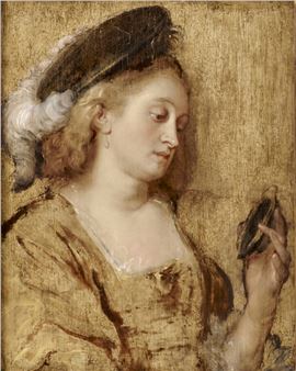 Young woman looking at herself in the mirror