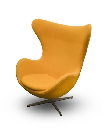 A bold, modern lounge chair with a sculpted form and metallic base.