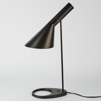 A sleek black desk lamp with a conical shade and circular base against a minimalist white background.
