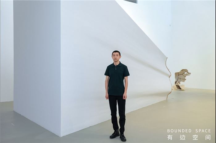 Kang Jing alongside work Outline #5 at the Somatic Memory exhibition opening, August 2, 2025 