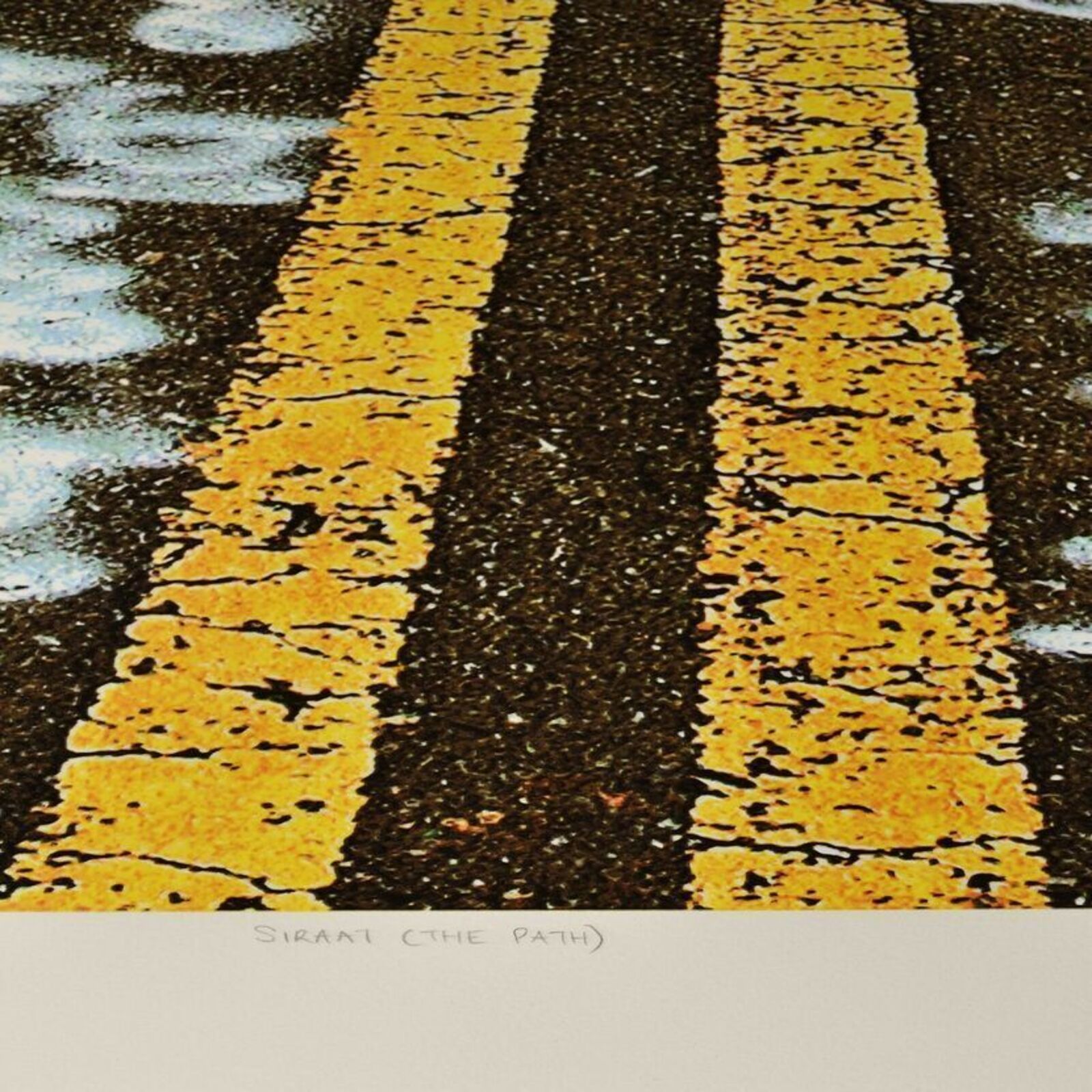 A picture of a road with writing on it.