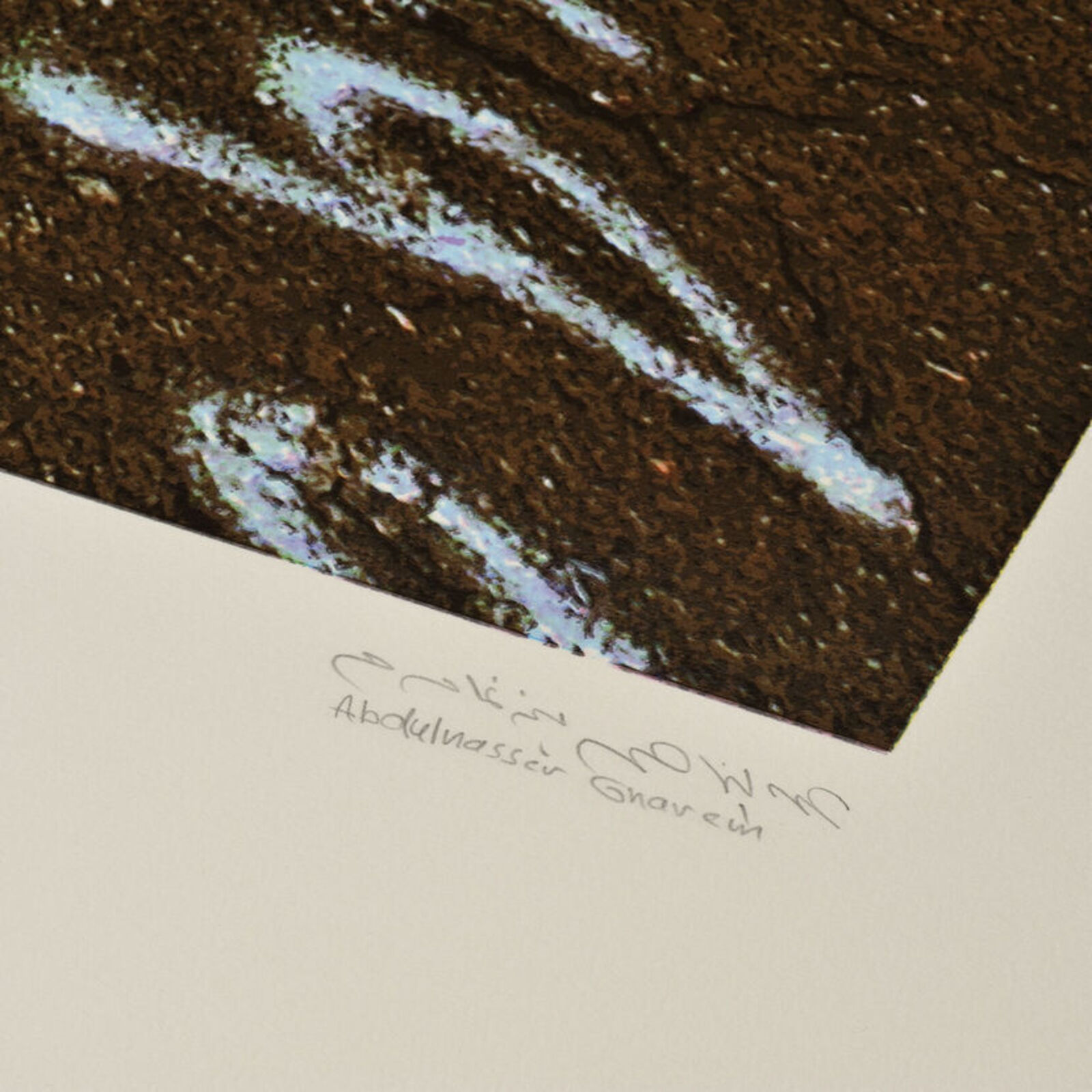 A picture of a road with writing on it.