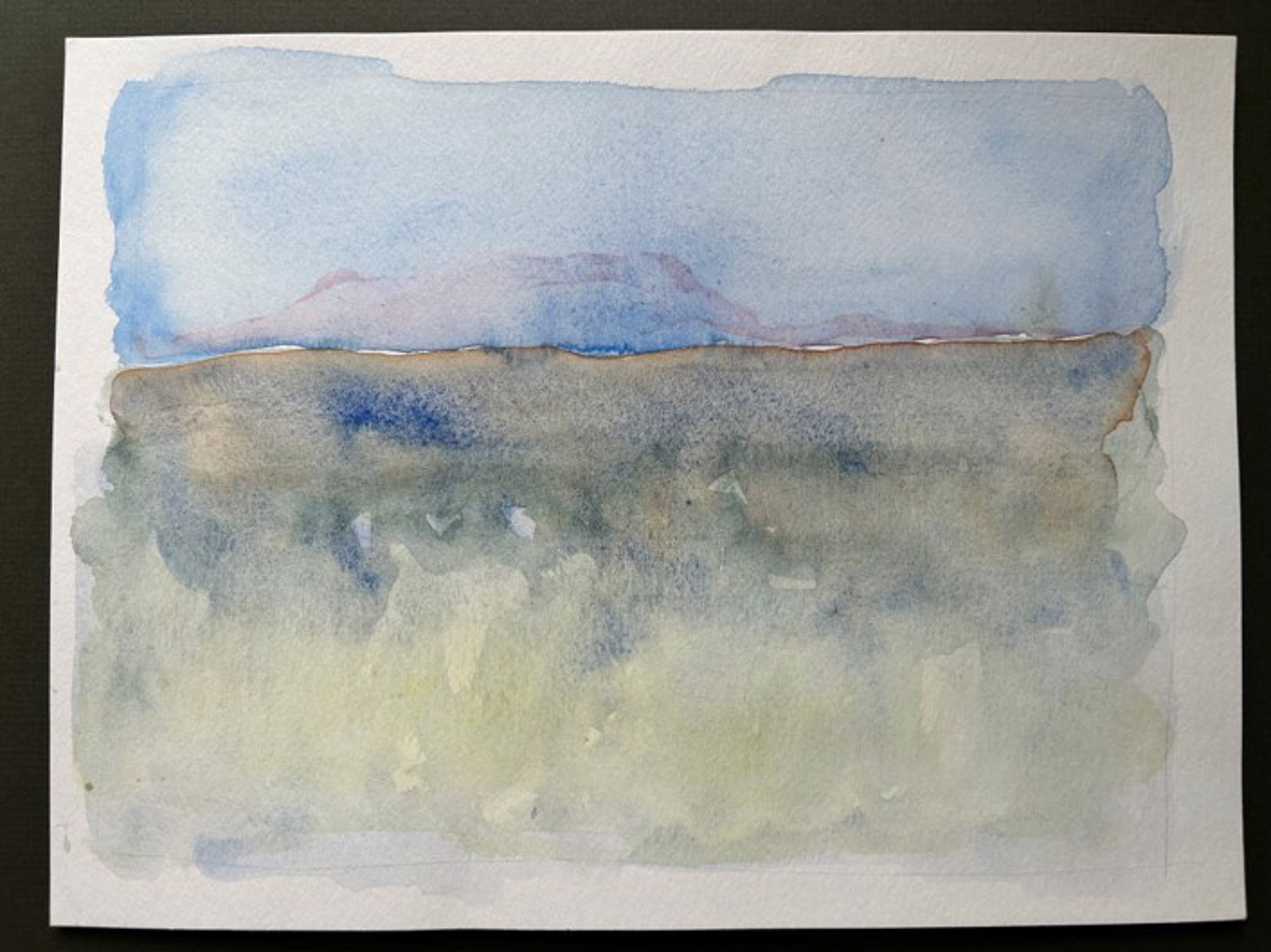 A layered watercolor landscape featuring a blue sky, distant hills, and a misty foreground.