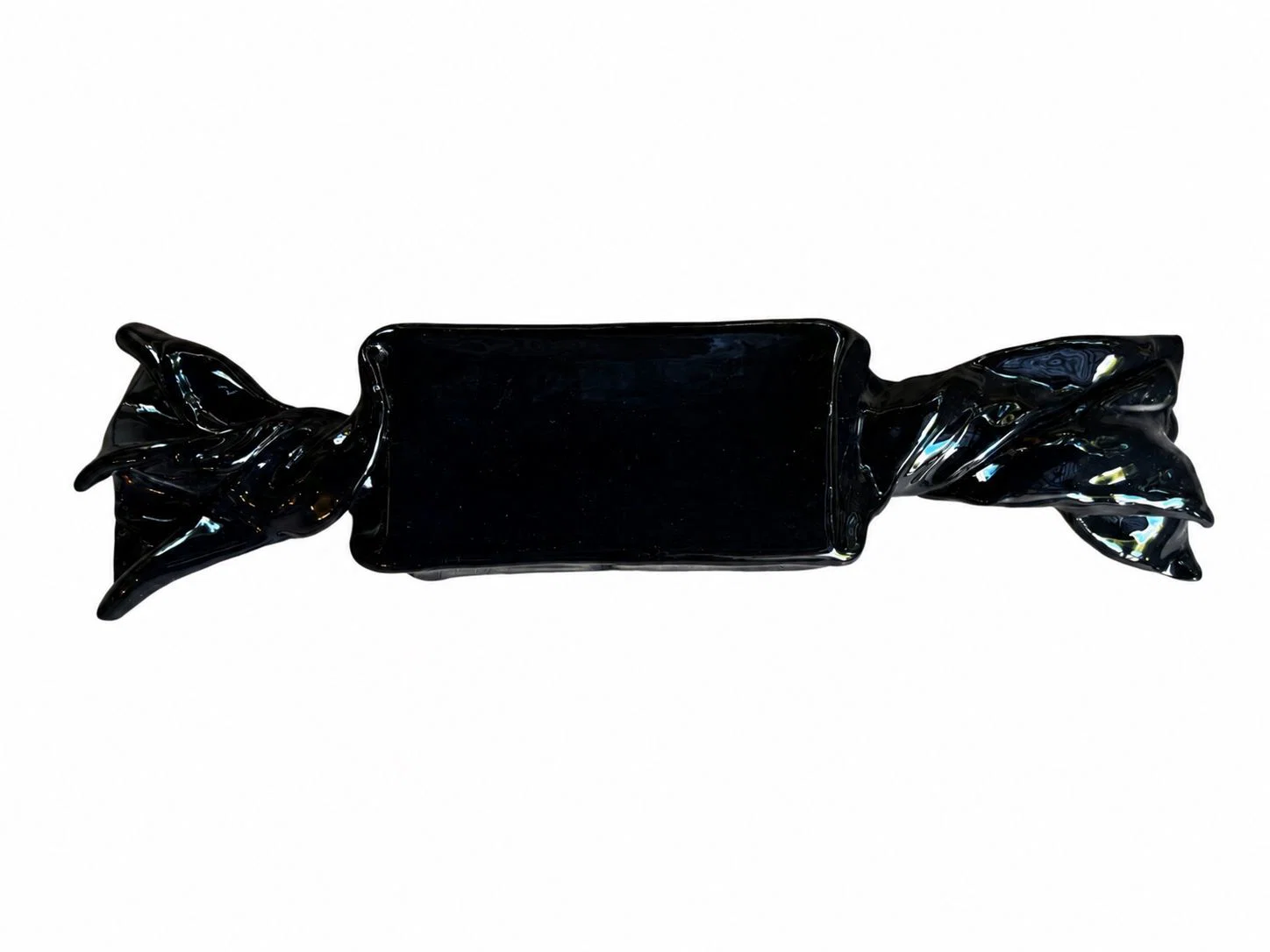 A glossy black ceramic tray shaped like a wrapped candy bar.