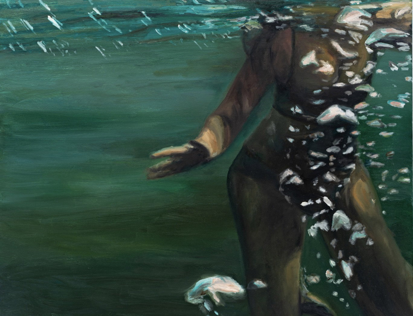 A figure submerged in dark green water, captured from a low angle with bubbles rising around them.