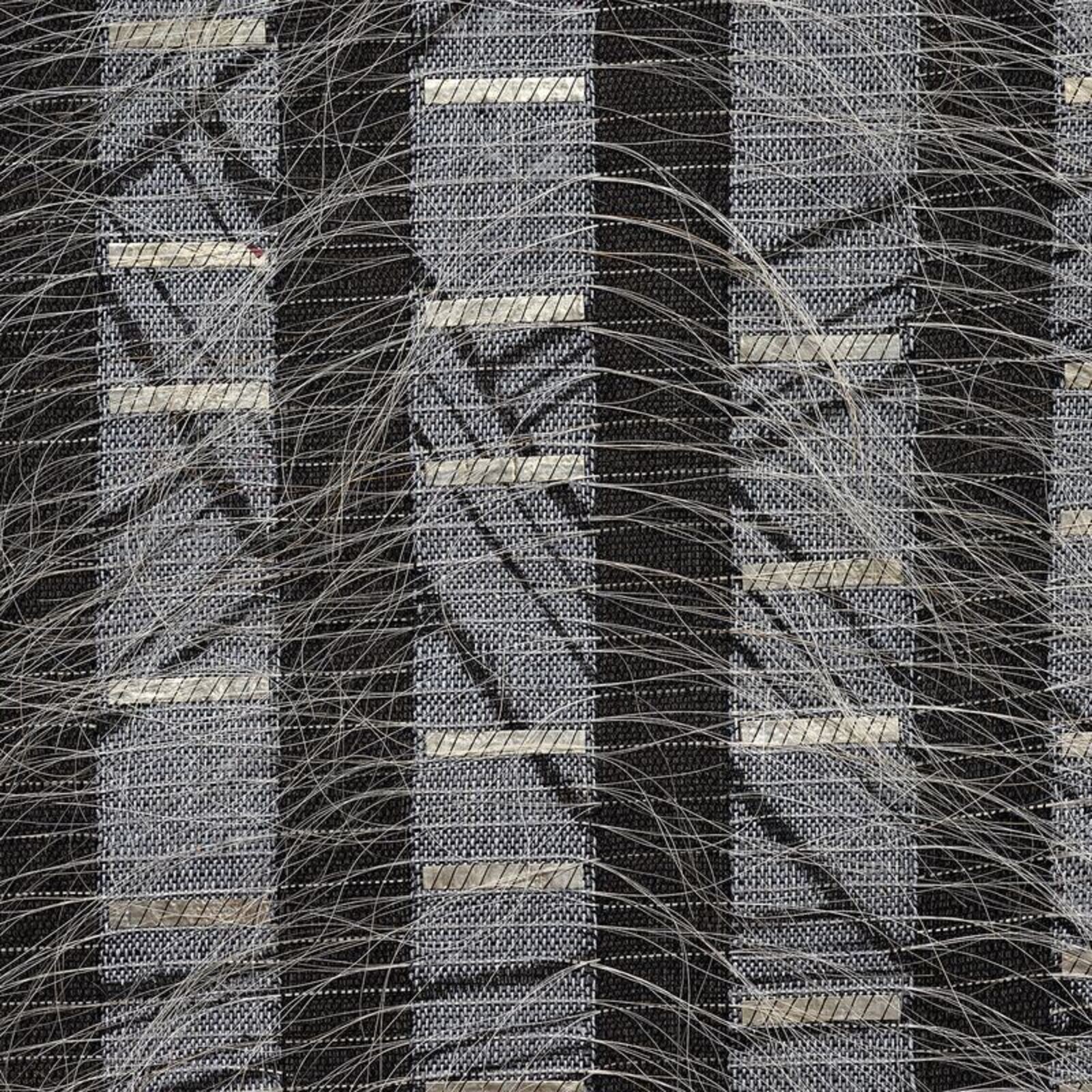 A monochromatic textile artwork featuring vertical stripes and diagonal lines.